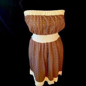 Brown and white strapless dress.